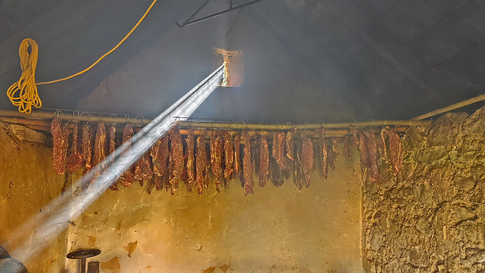 Biltong hanging the smokehouse.